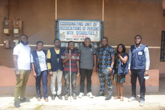 The CUAPWD Management with the team members of YEMS Group standing outside the Office of the Coordinating Unit