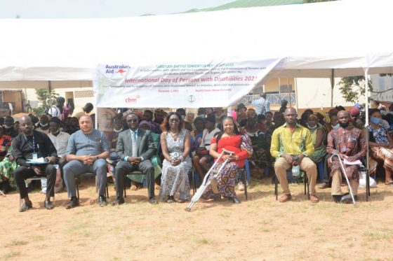 A Family photo of the Leader and Stakeholders of the Disability movement including CUAPWD's Board Chair during the International Day of Persons with Disabilities at CBC Ceremonial Ground