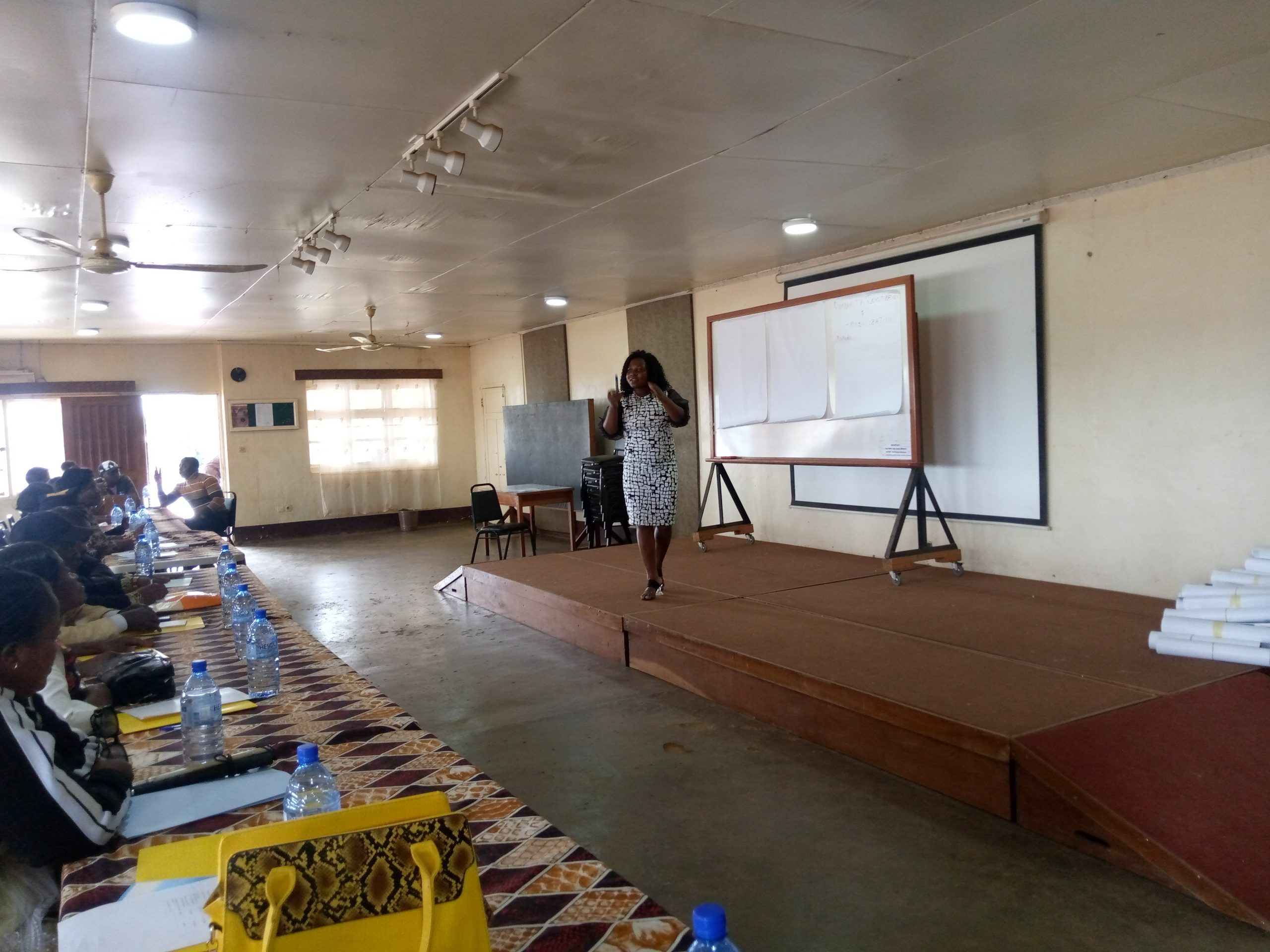 Finance Officer from CUAPWD teaching on Community Sensitization Methods